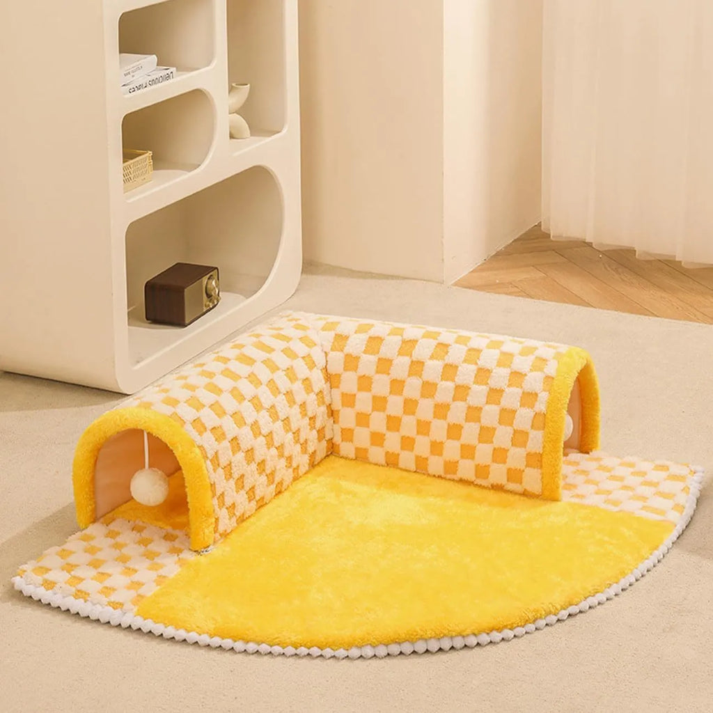 Fan-shaped plush pet bed for dogs and cats with a central tunnel, shown in a yellow colour.