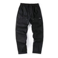 Antibacterial cotton wide-leg trousers in milky white showing the all-matching pants-mouth ankle design.