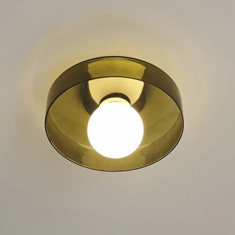 White round glass ceiling light fixture with a 25cm diameter shade.