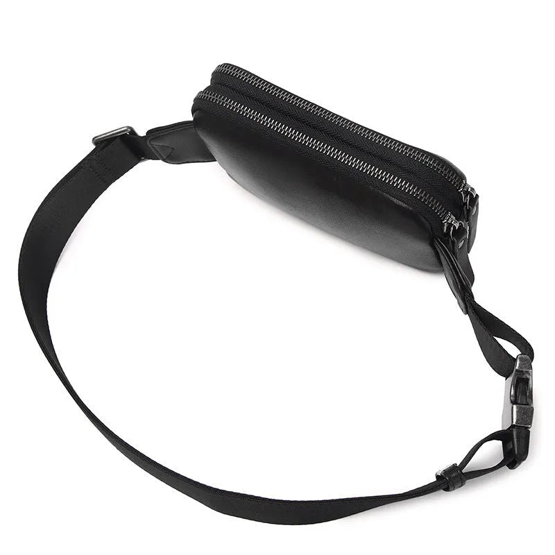 Small black cowhide leather crossbody bag for men with nylon lining.