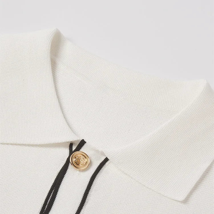 White short sleeve cardigan with contrasting colour lapels on a hanger