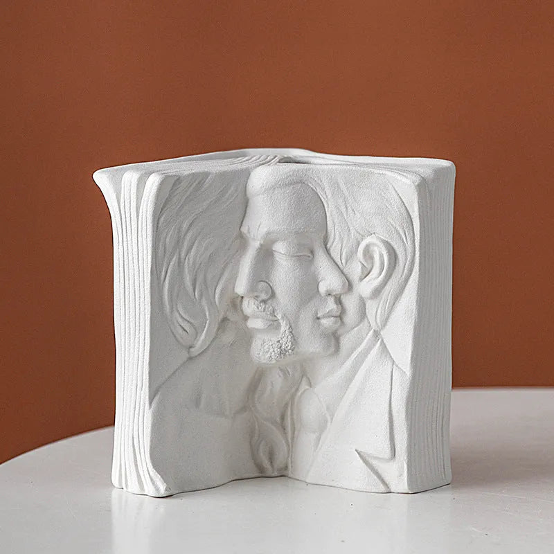 Ceramic book stand with glazed finish in a modern minimalist design on a desktop.
