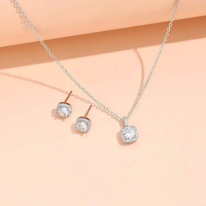 Female minimalist square diamond necklace and earring set in gold and silver colour options