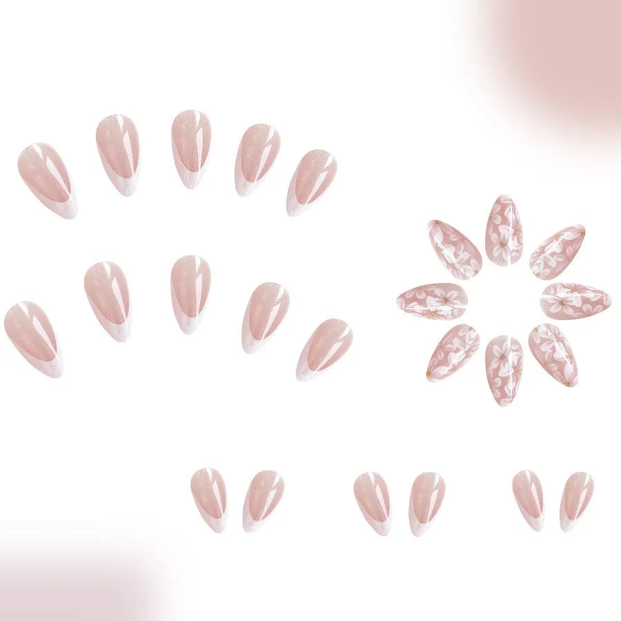 Short almond French manicure artificial nails with glitter and flower patterns in colour C625.