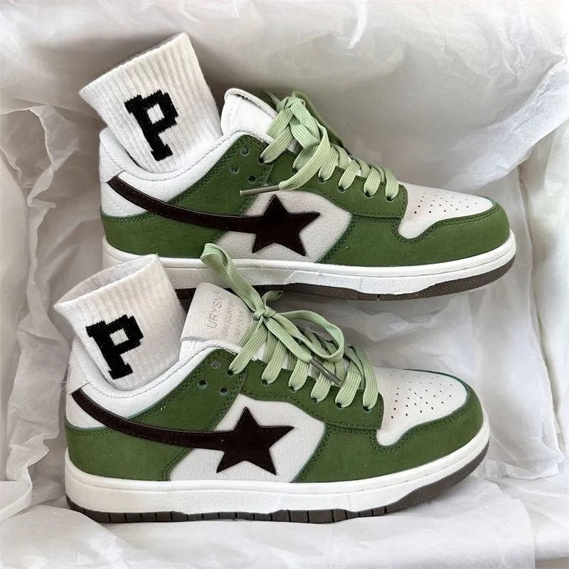 Retro style women's board shoes in green with lace-up closure and flat rubber sole