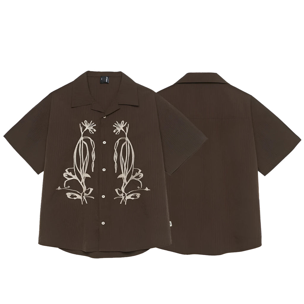 Man wearing brown striped waterproof short sleeve shirt with Cuban collar for outdoor camping.