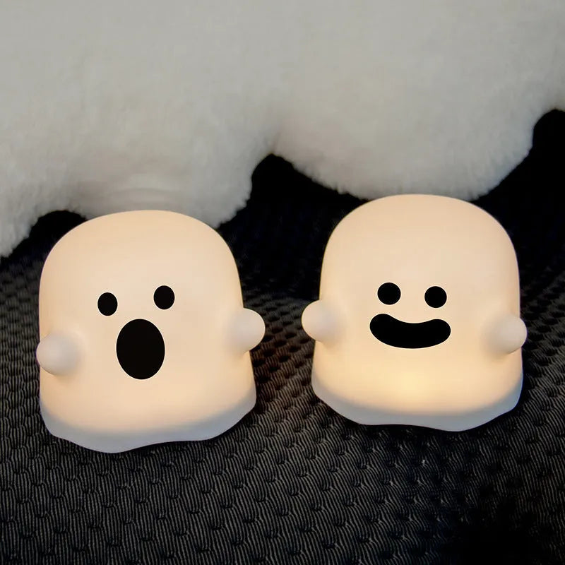 Silicone touch sensor LED night light on a bedside table showing soft glow.