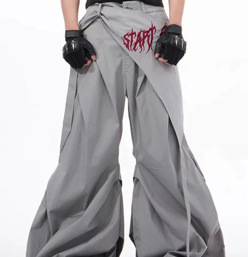 Boy modelling black Korean-style wide-leg summer trousers in a casual setting.
