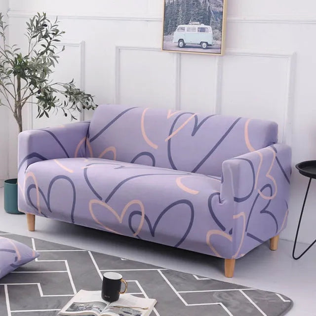 Elastic three-seat sofa cover in polyester blend fabric, stretched over a sofa, available in multiple colours A-J