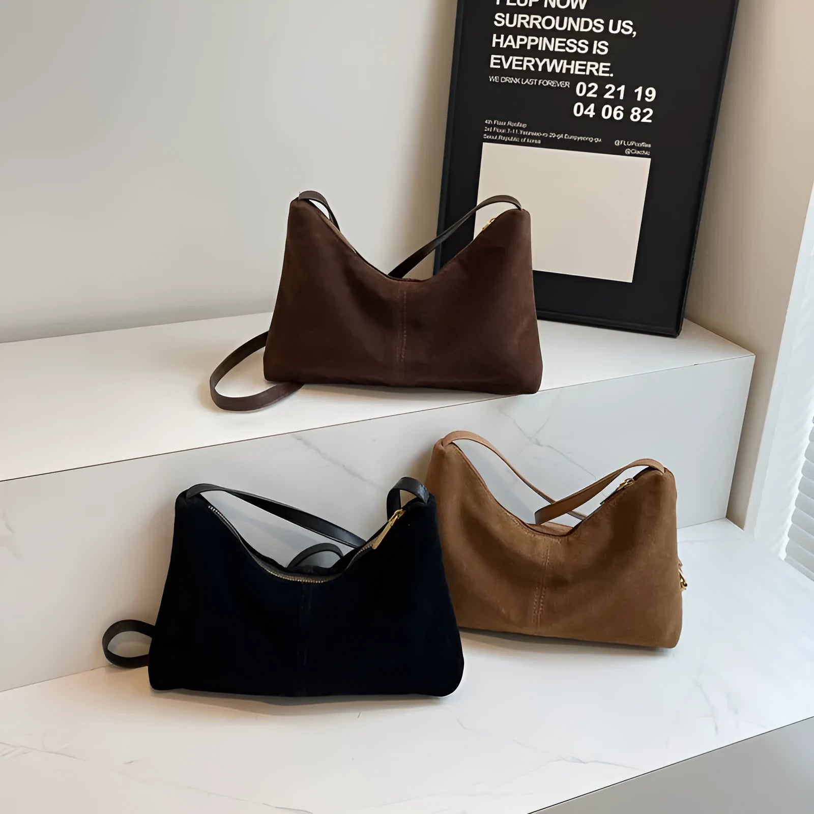 Retro suede underarm bag in black with bucket shape, sandwich pocket, and visible sewing detail