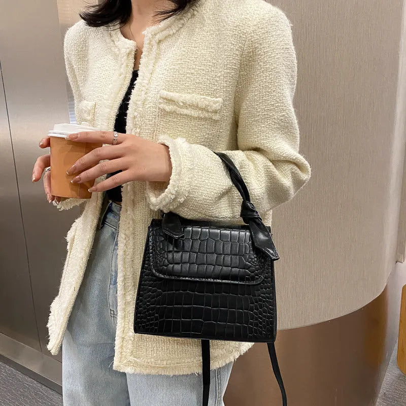 Women's small square retro armpit bag in black with stone pattern PU exterior and magnetic buckle