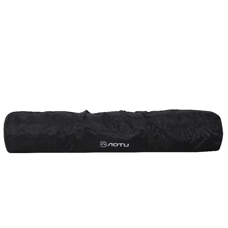 Green and grey waterproof storage bag for camping tents and folding chairs, shown with gear inside and folded compactly.