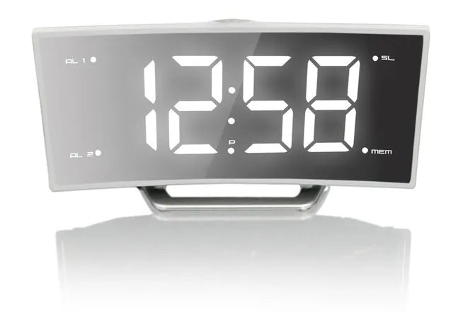 Curved screen LED projection alarm clock showing time on display with USB port and FM radio controls