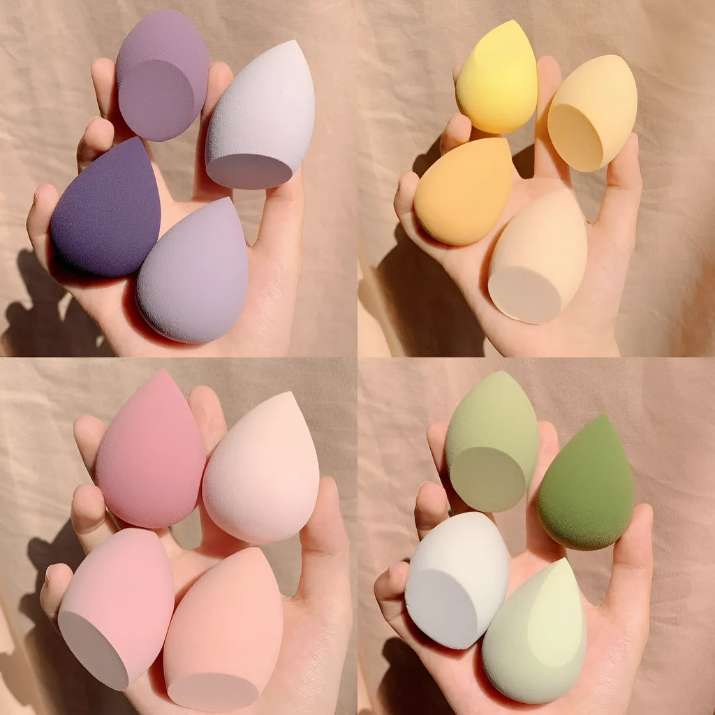Four coloured synthetic makeup sponge eggs in grape, mango, mint and peach peach
