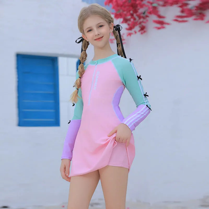 Pink polyester girls swimsuit with split skirt, sizes 3XL to 7XL, conservative children's swimwear