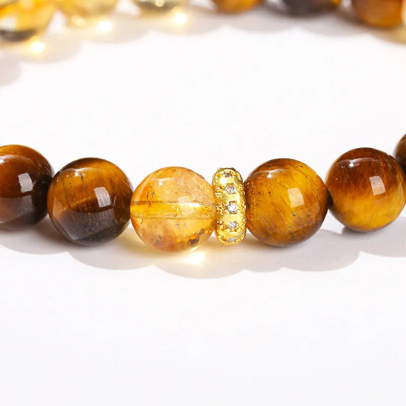 Close-up of a women's yellow tiger-eye stone and crystal bracelet with 8mm round beads.