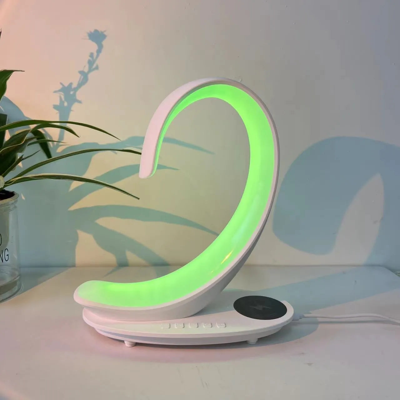 White Swan animal figure desktop wireless charger with Bluetooth speaker and colourful atmosphere light.