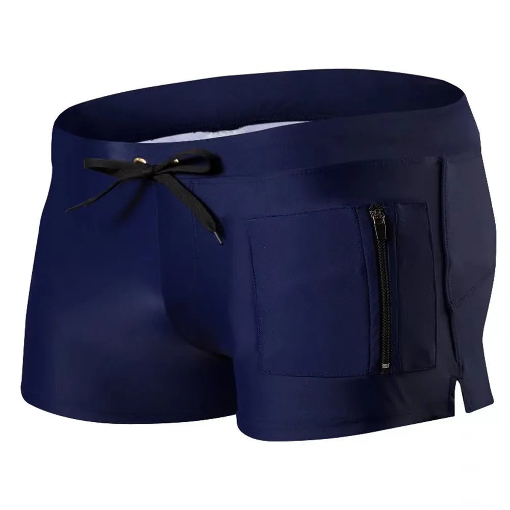 Men's black high waist swimming trunks with a lace-up front closure on a solid colour background.
