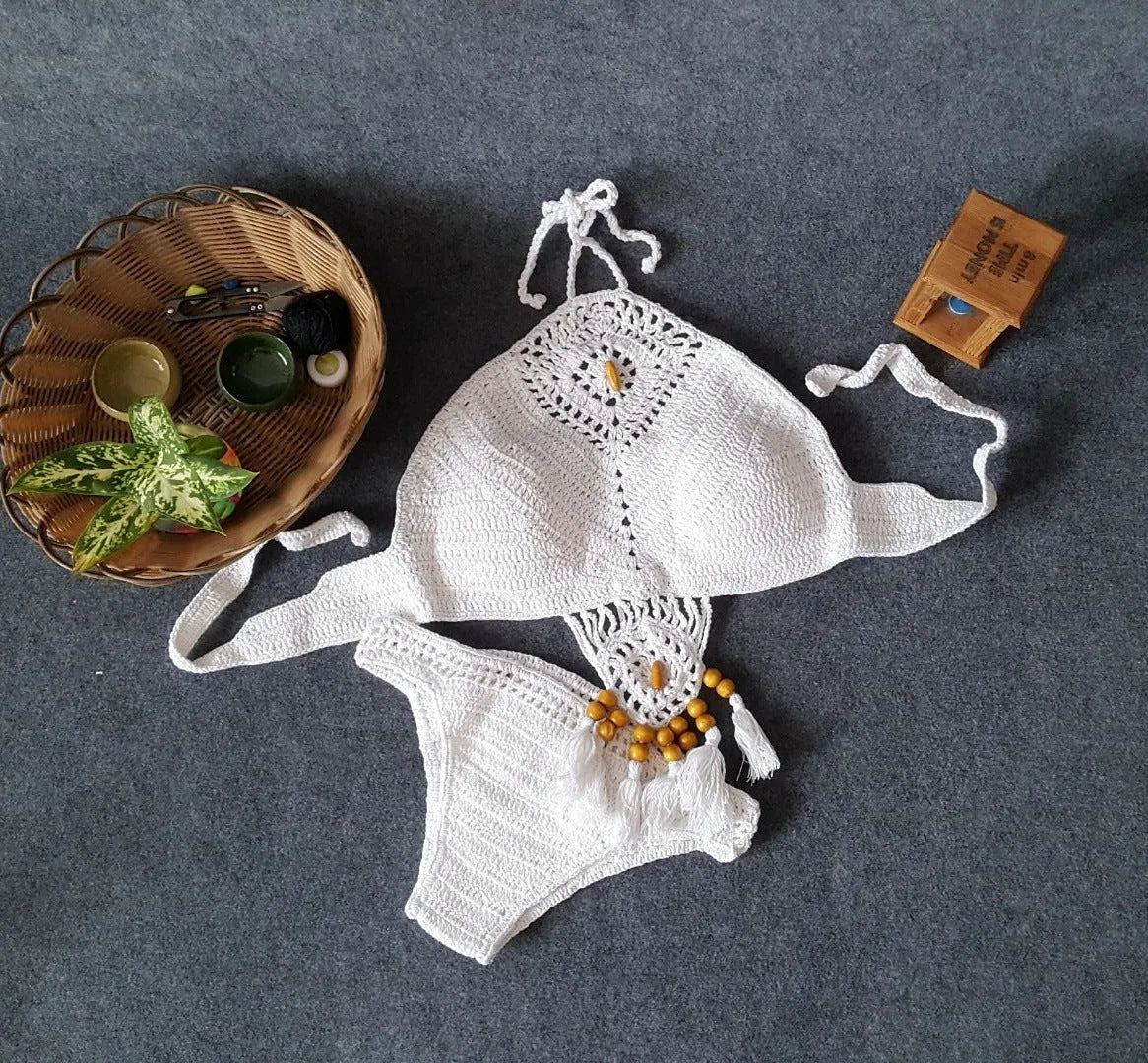 Women's crochet tassel bikini set in black, khaki, and white with tassel details, beachwear