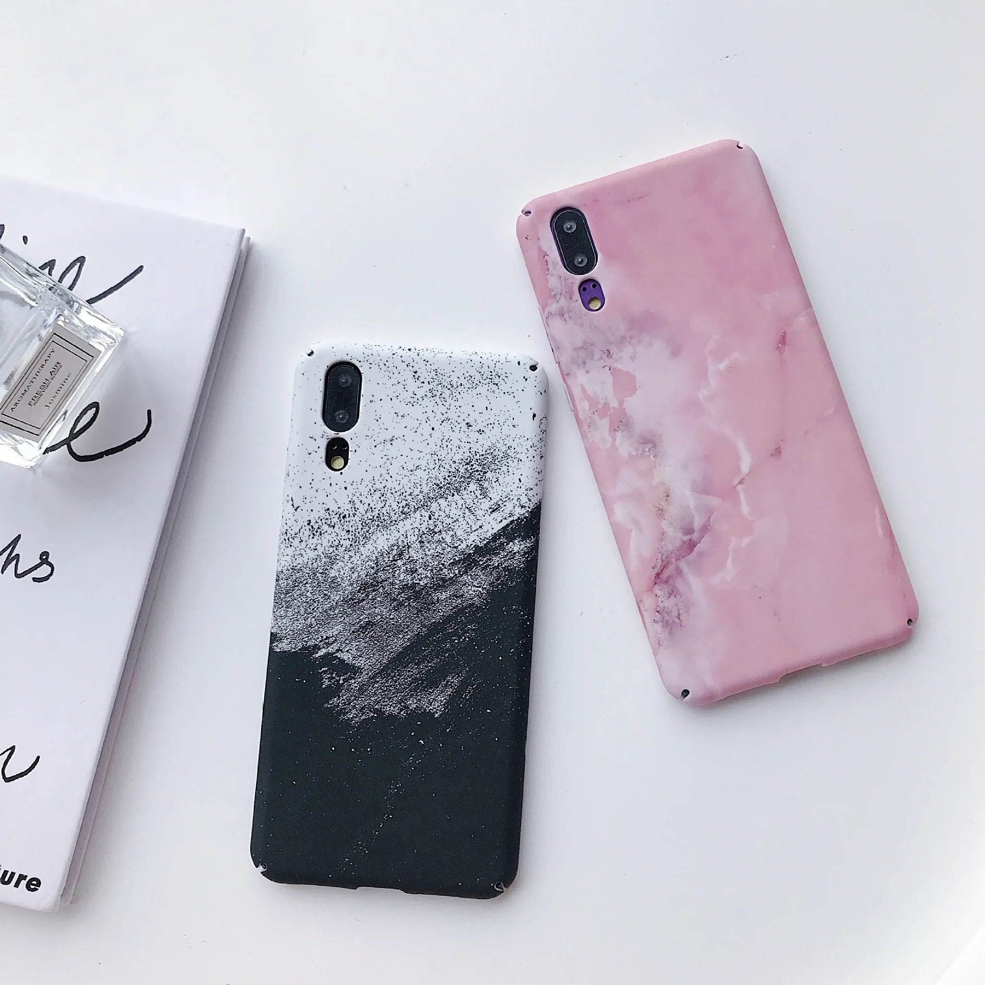 Painted pure colour black and pink phone back cover cases for Huawei models on a white background.