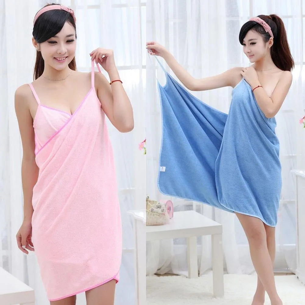 Long blue beach towel dress worn as a robe, showing its length and simple design.