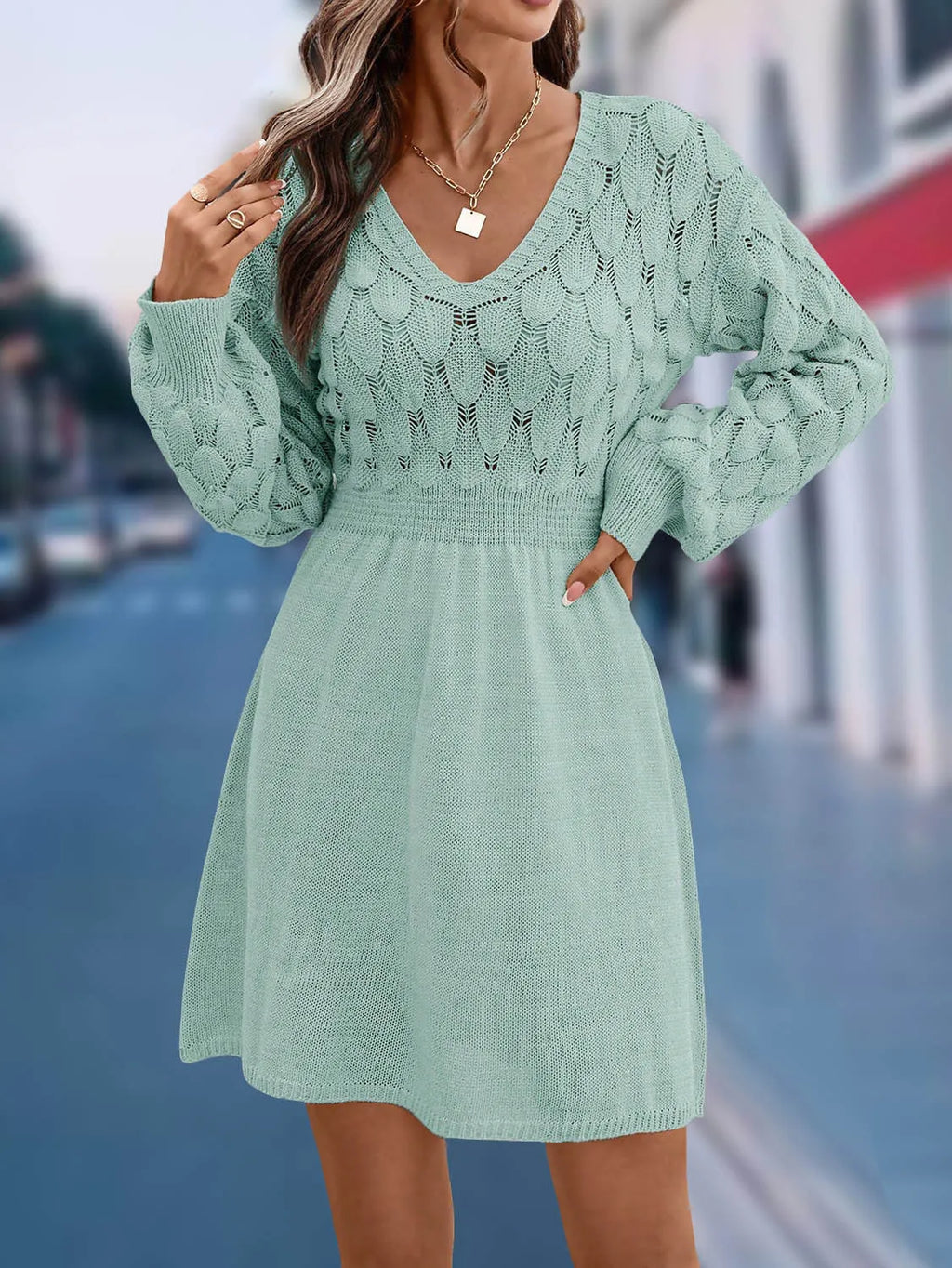 Women's long sleeve apricot V-neck dress with high waist and 3D pattern detail.