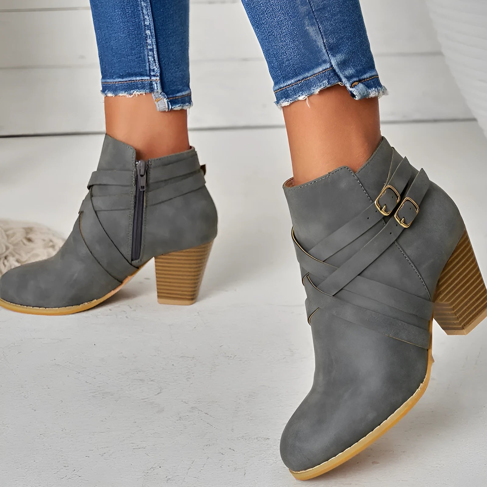 Grey PU leather short ankle boots with a side zipper, buckle strap, and a chunky 7cm heel.