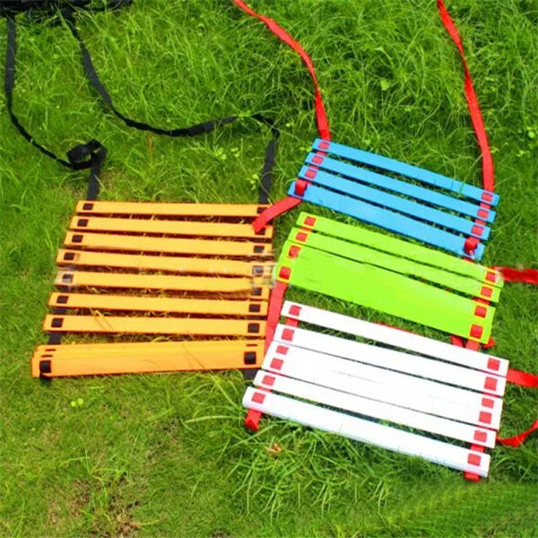 PP jump ladder in black laid flat on grass for foot basket training