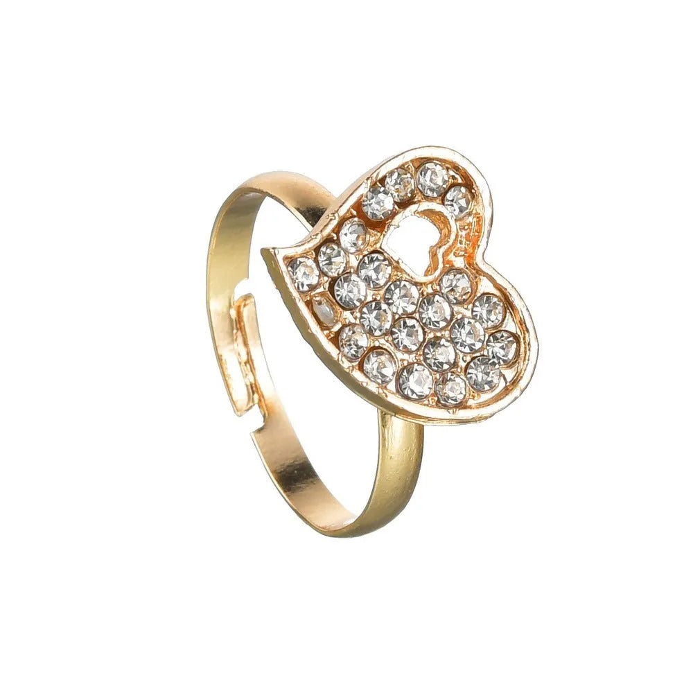 Women's gold tone alloy jewelry set with matching earrings, pendant and bracelet featuring love patterns