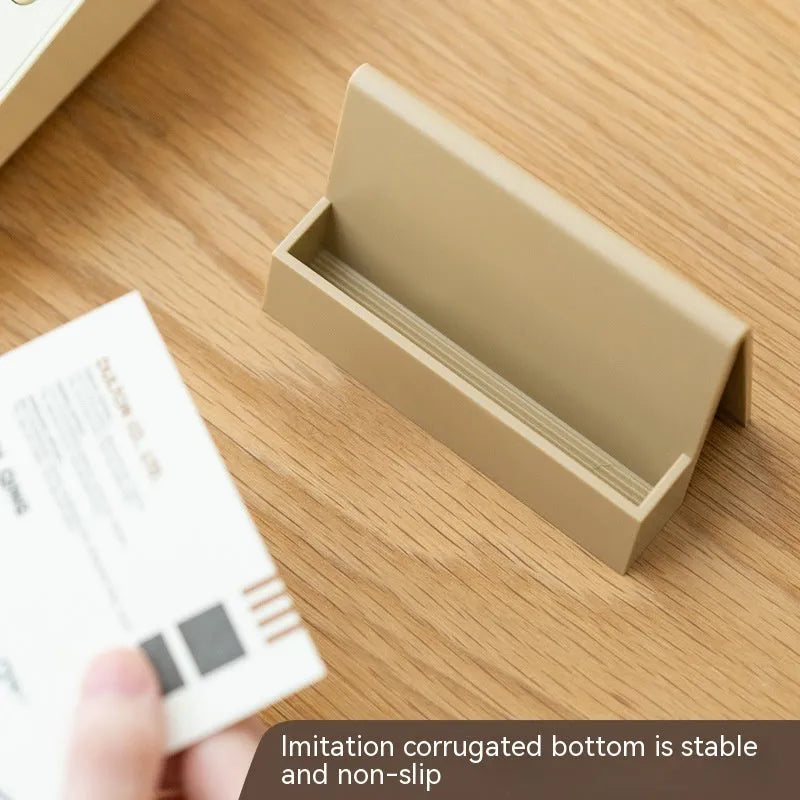 Creative business card storage display stand in geometric design, holds 20 cards, available in five colours