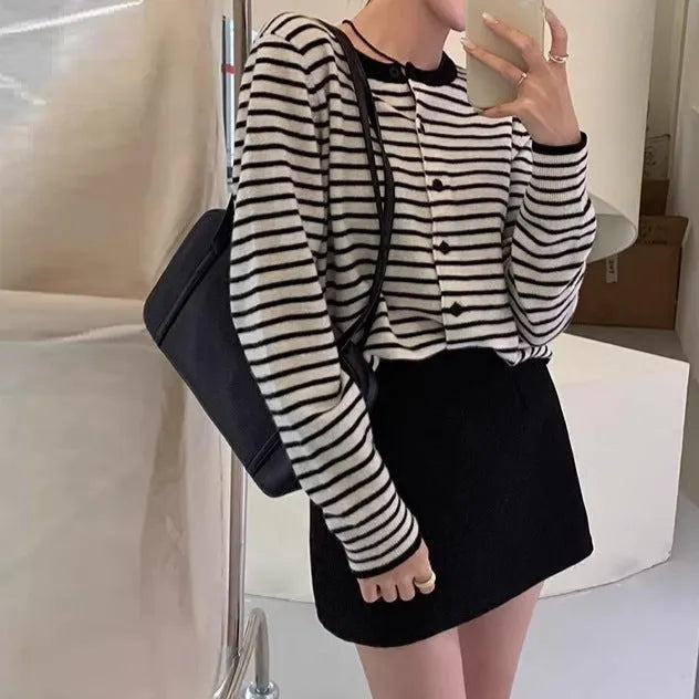 Dark grey and white striped women's cardigan coat with long sleeves and a slim, short fit.