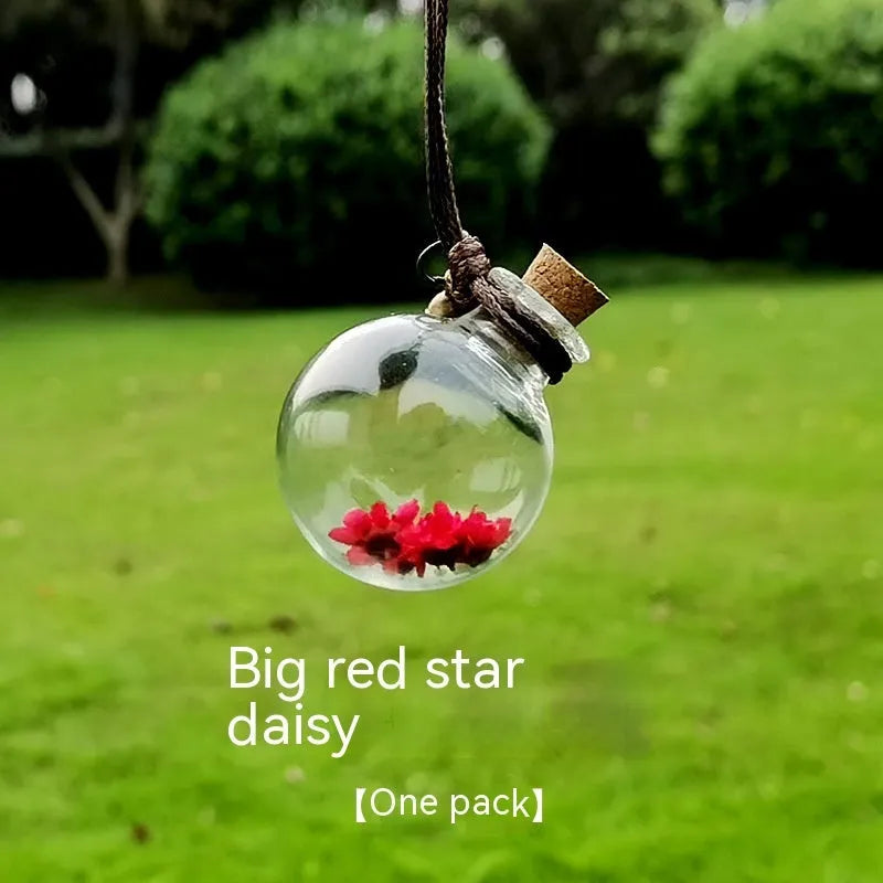 Glass car perfume pendant with preserved flowers for interior decoration and air freshening