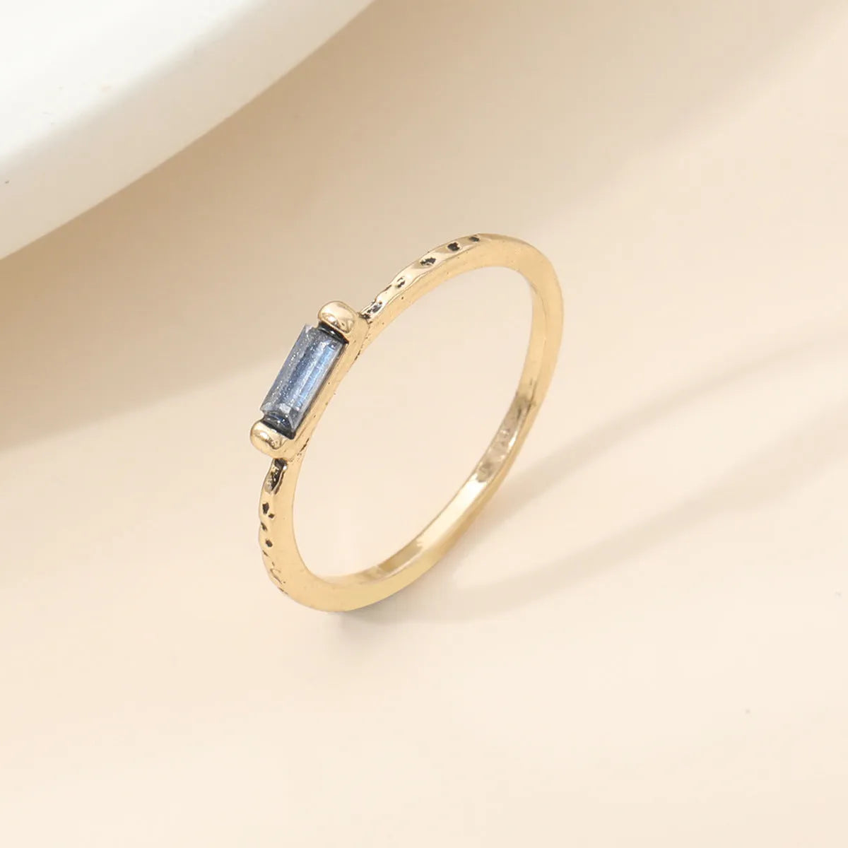 18K gold electroplated ring with square white cubic zirconia stone on geometric zinc alloy band, unisex sizing No 6-10