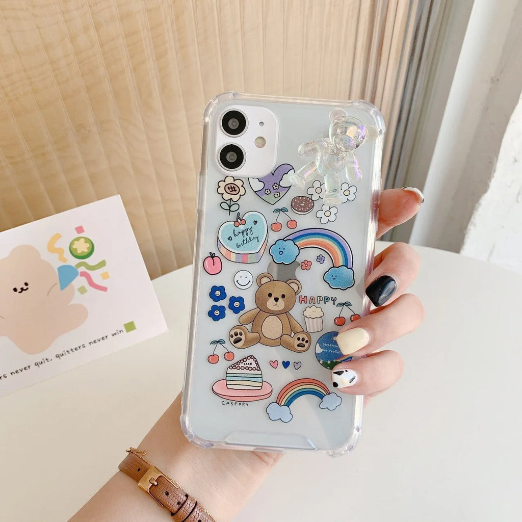 Transparent TPU iPhone case with bear chain and pendant attachment showing phone protection
