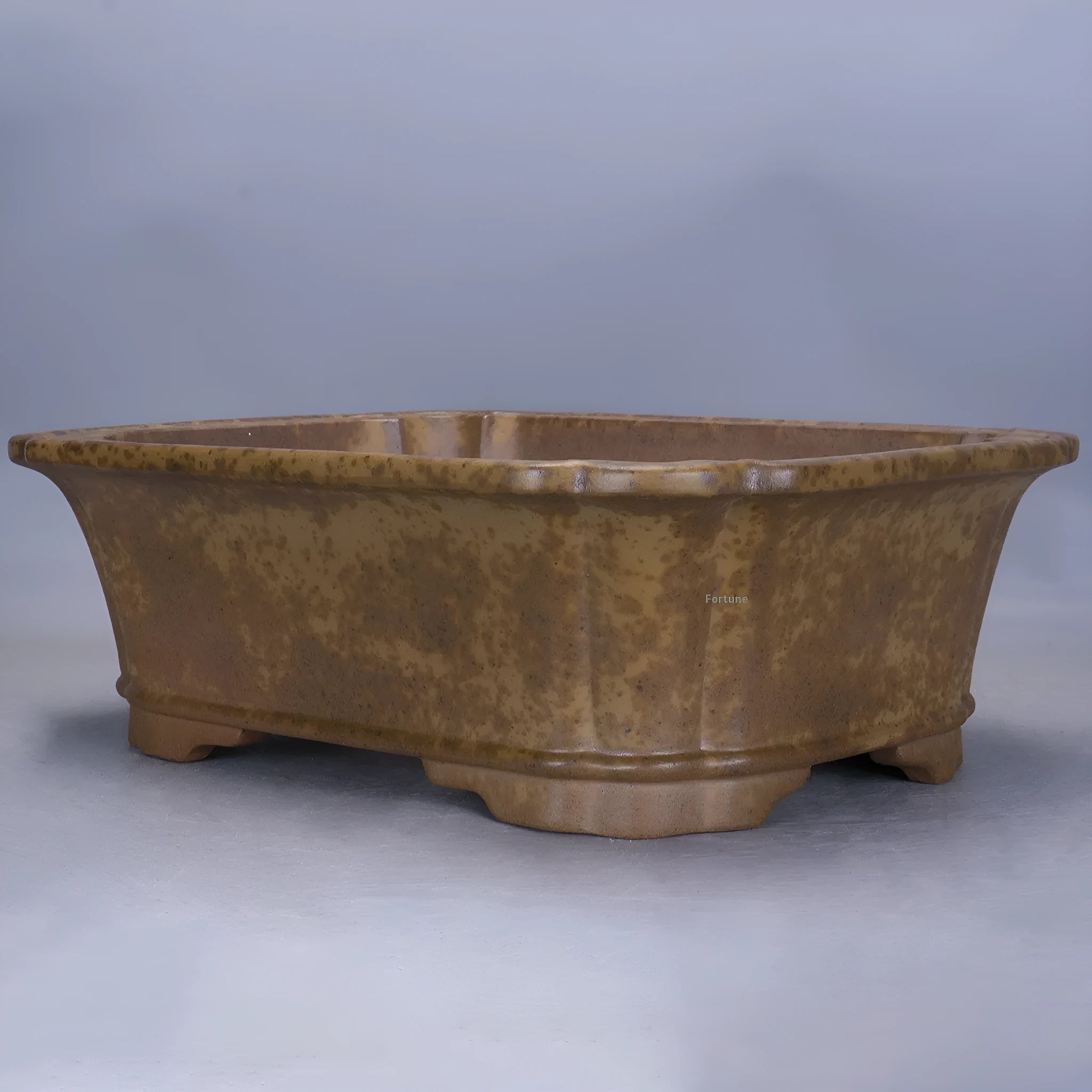 Large rectangular purple sand flowerpot with modern segmented design on a floor.