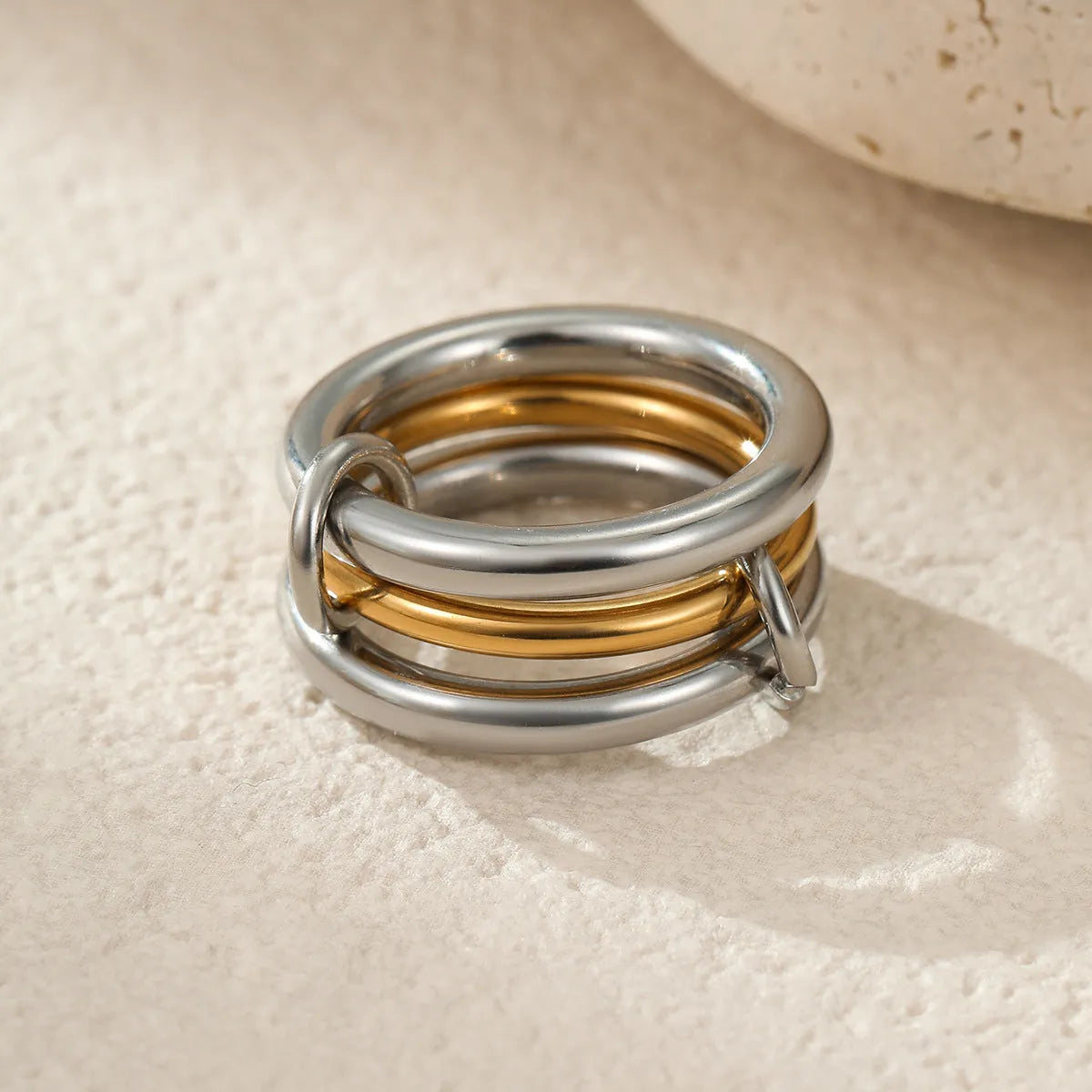 Stacked stainless steel rings with 18K gold plating in free size adjustable design