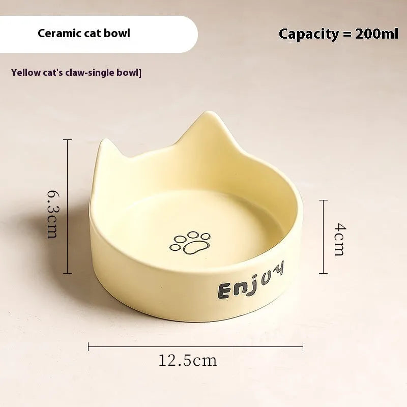 Porcelain cat bowl with cat ear and paw design on a wooden feeding frame, in pink colour.