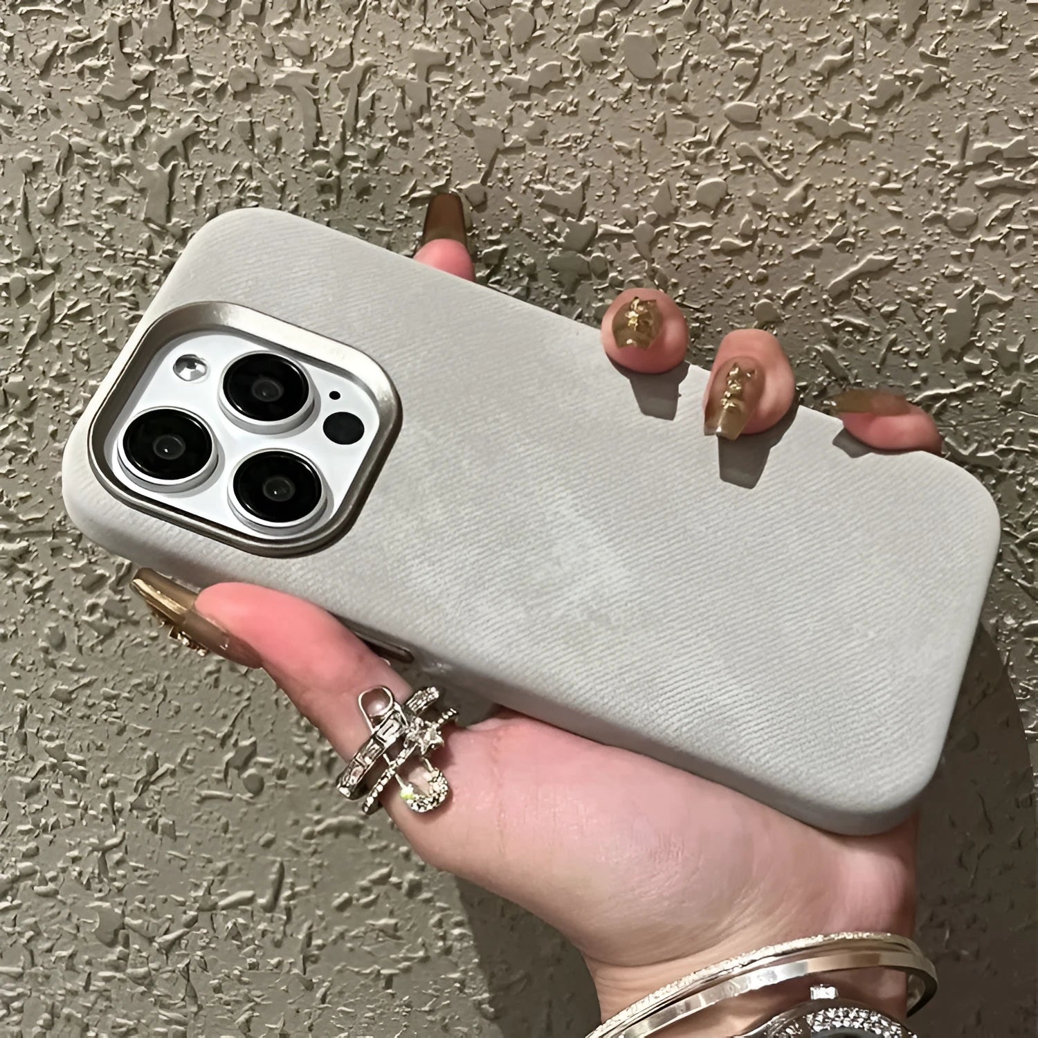 Magnetic velvet flannel hard phone case for iPhone in silver grey colour showing magnetic ring.