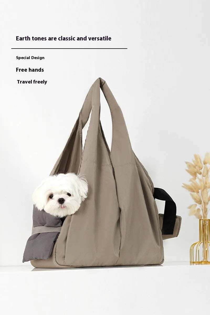 Apricot coloured cloth pet handbag carrier for cats or small dogs.