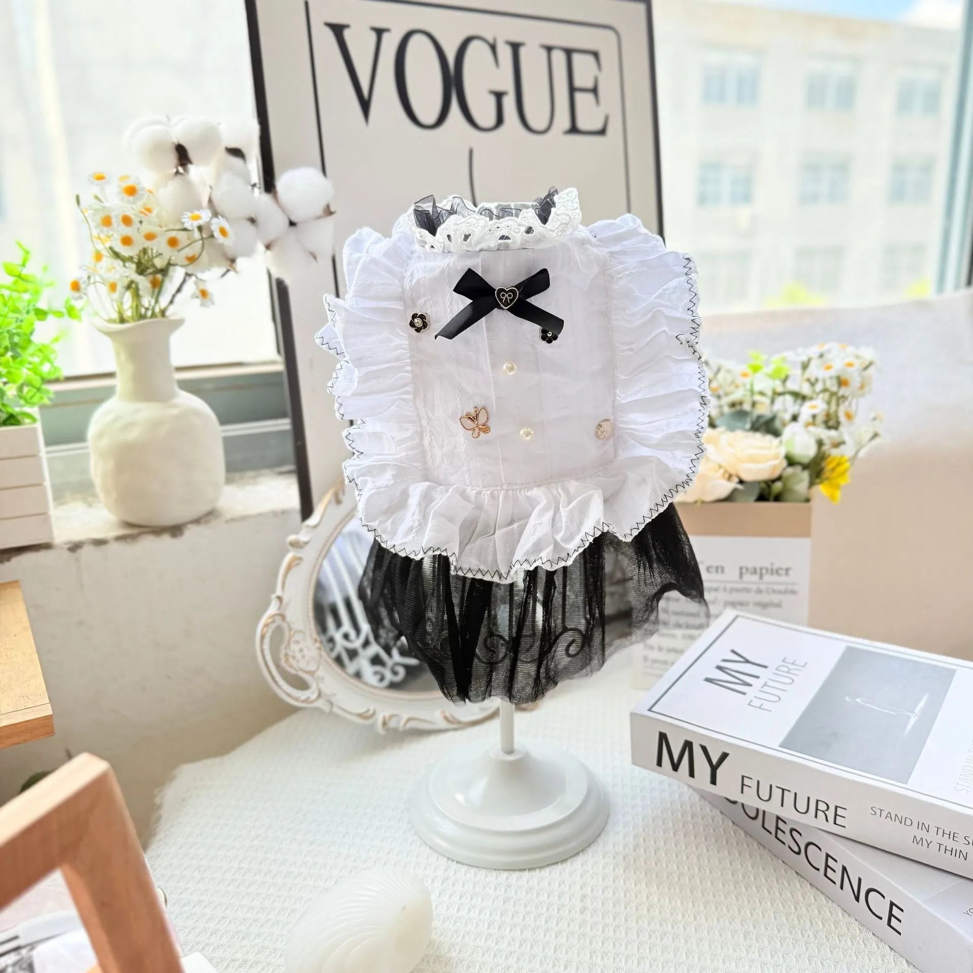 White polyester gauze skirt dog dress on a small dog, showing princess-style gathered skirt.