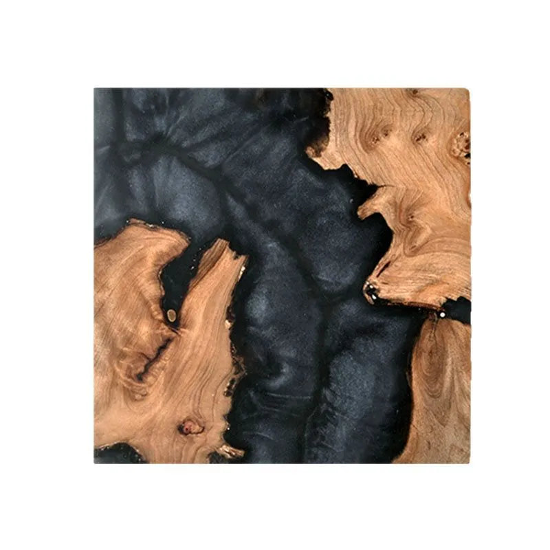 A solid colour resin coaster on a wooden table, showing its 1cm thickness and irregular Nordic shape.