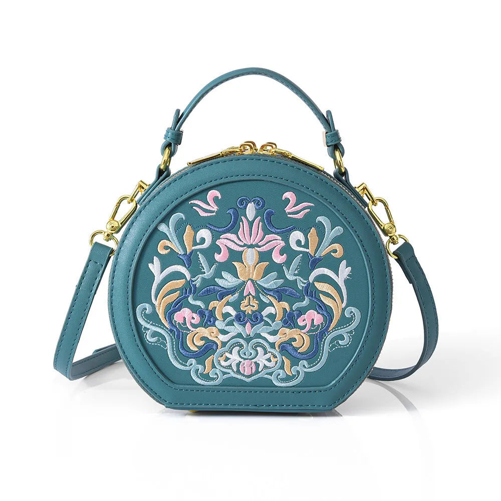 Round PU crossbody bag with embroidery, peacock blue colour, small size, front view