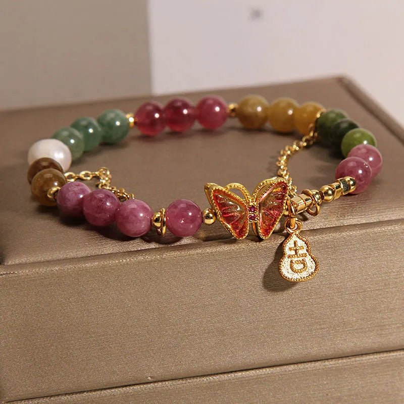 Natural jade coloured agate bracelet with butterfly and gourd pendant.