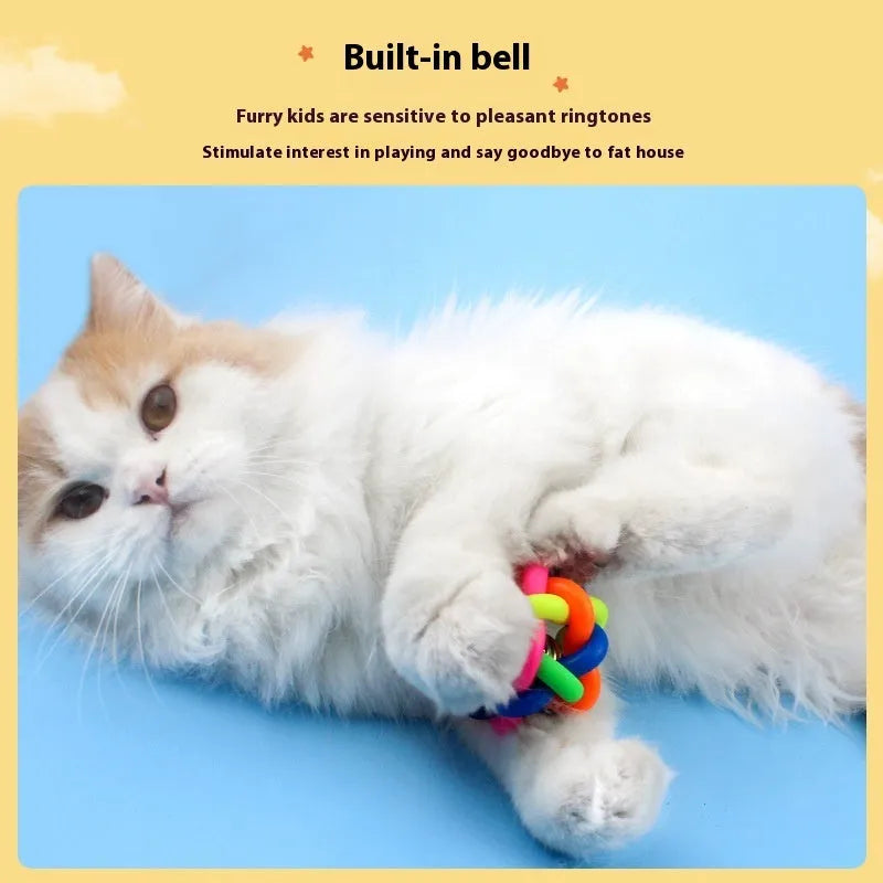 Colourful woven plastic pet toy ball with bell in rainbow colour on white background