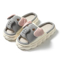 Elephant grey open-toe linen slippers for couples on a plain background, showing animal pattern detail and sewn sole.