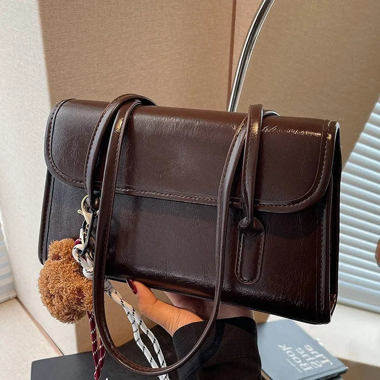 Brown women's horizontal square PU leather shoulder bag with pendant charm and double straps