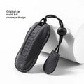 Suede car key cover in cement grey, dark green, light grey, and orange colour options.
