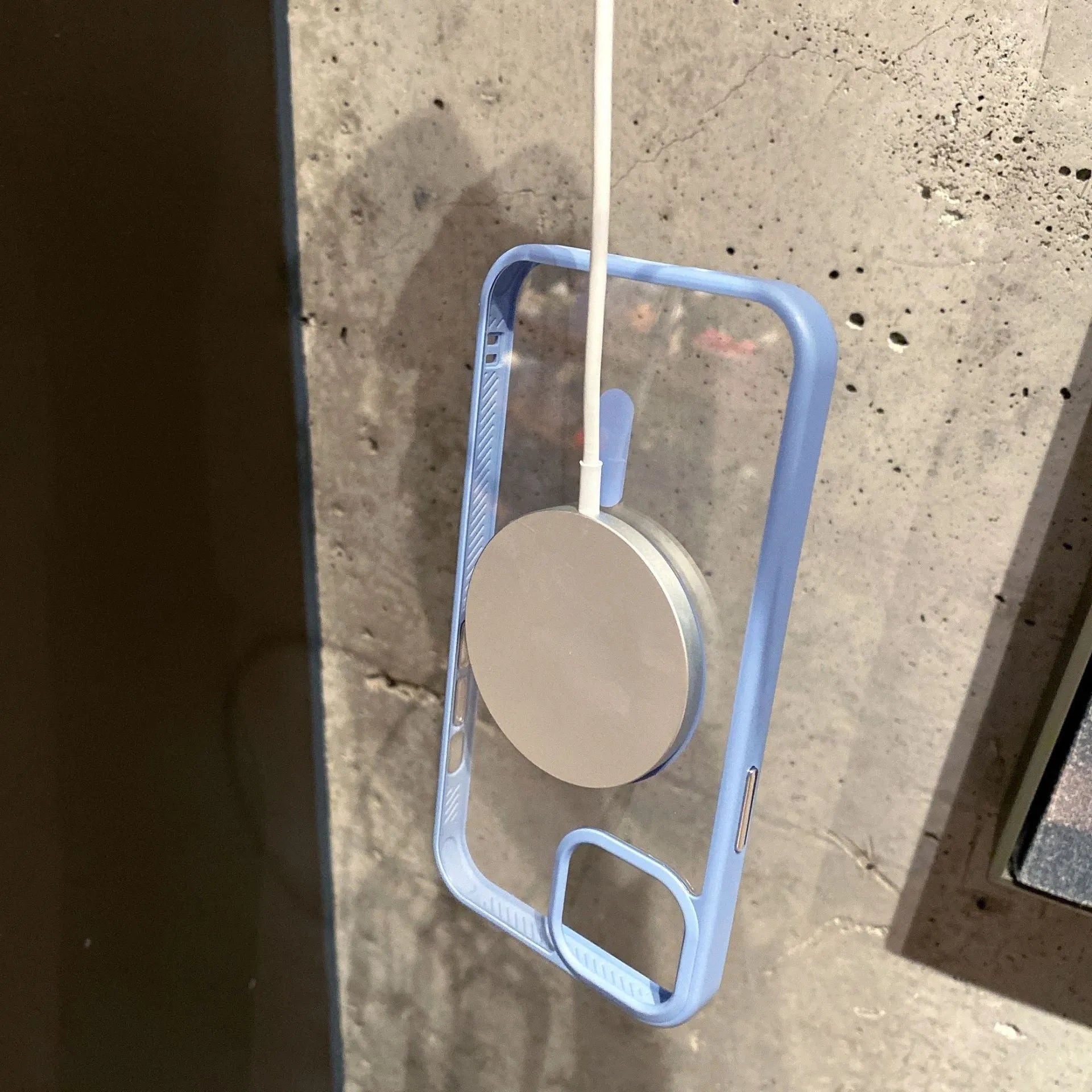 Transparent MagSafe iPhone case showing magnetic ring compatibility in blue colour option