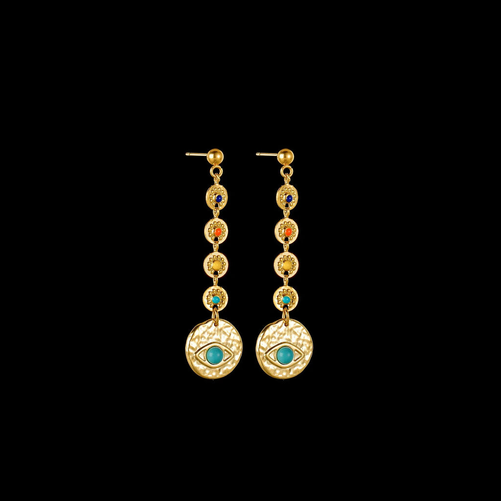 Three geometric stainless steel earrings showing star, eye and shell sun designs