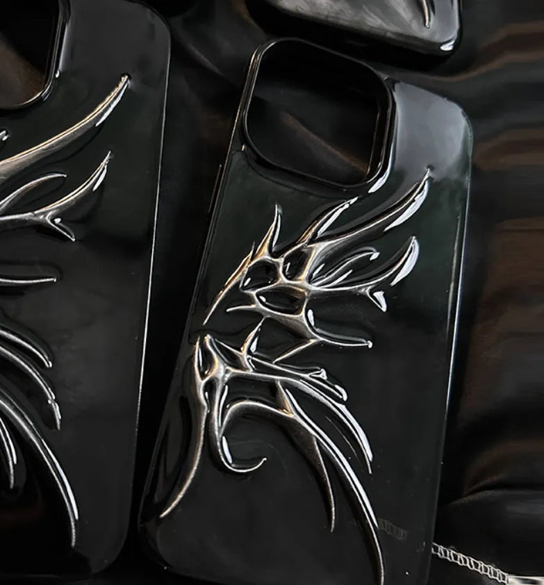 Black iPhone case with three-dimensional blurred wings design showing raised edges and precise port cutouts